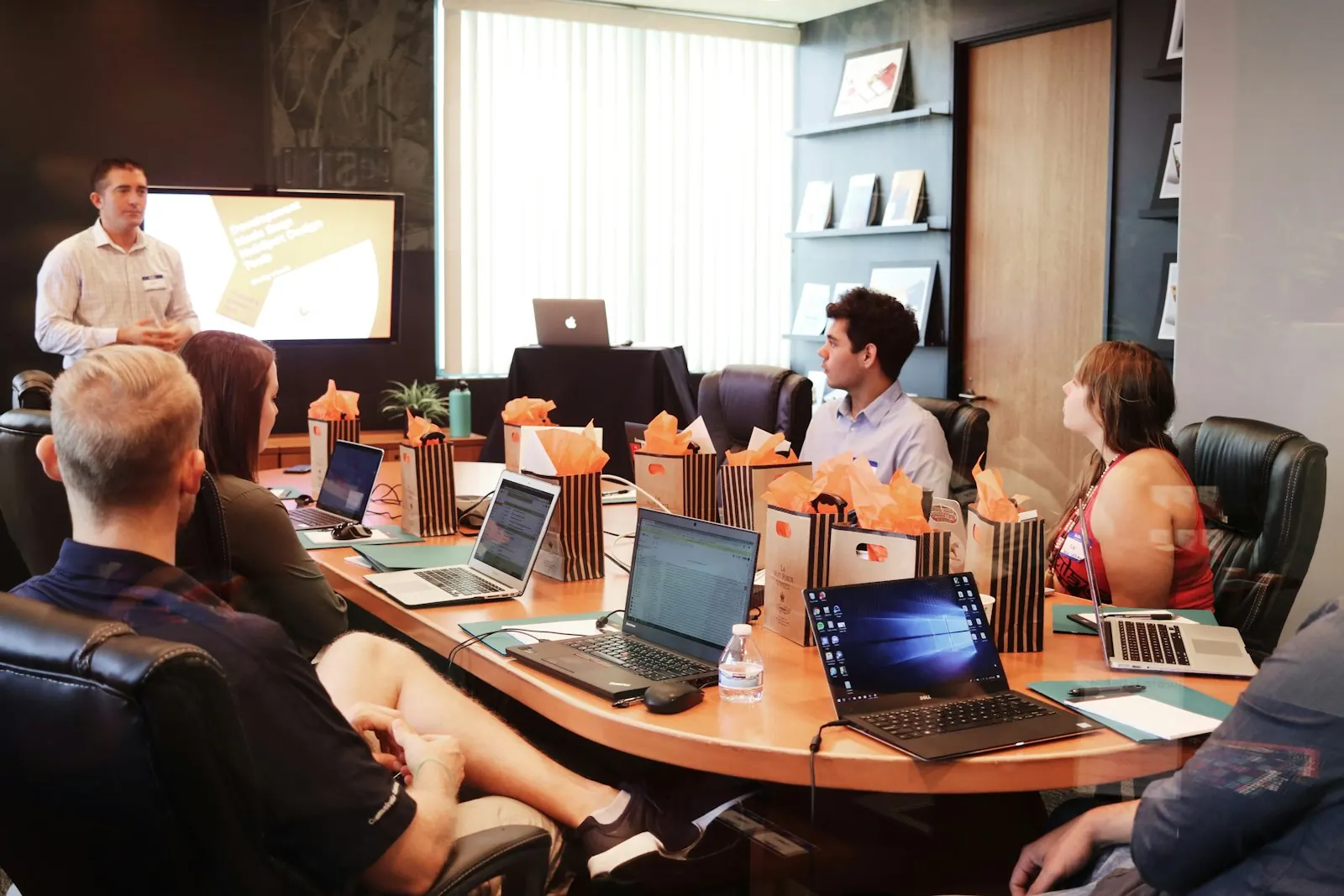 Business team in a meeting room planning an enterprise software rollout across multiple departments